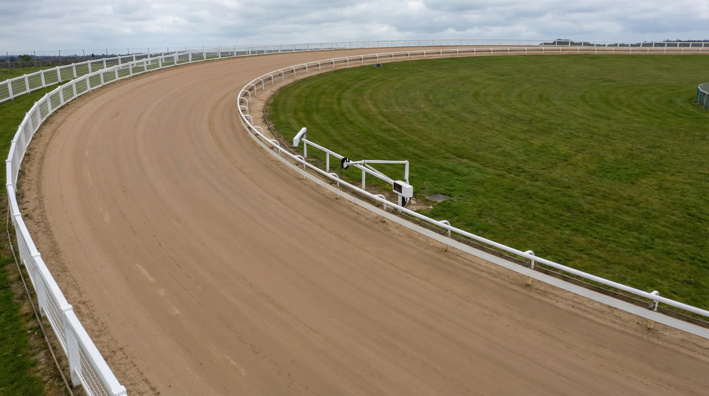 View of the Doncaster greyhound track showing the first bend and sand surface at Meadow Court Stadium
